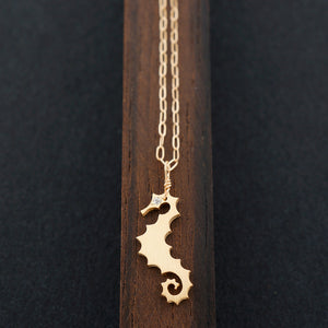 
            
                Load image into Gallery viewer, Minimalist Dragon Seahorse Necklace
            
        